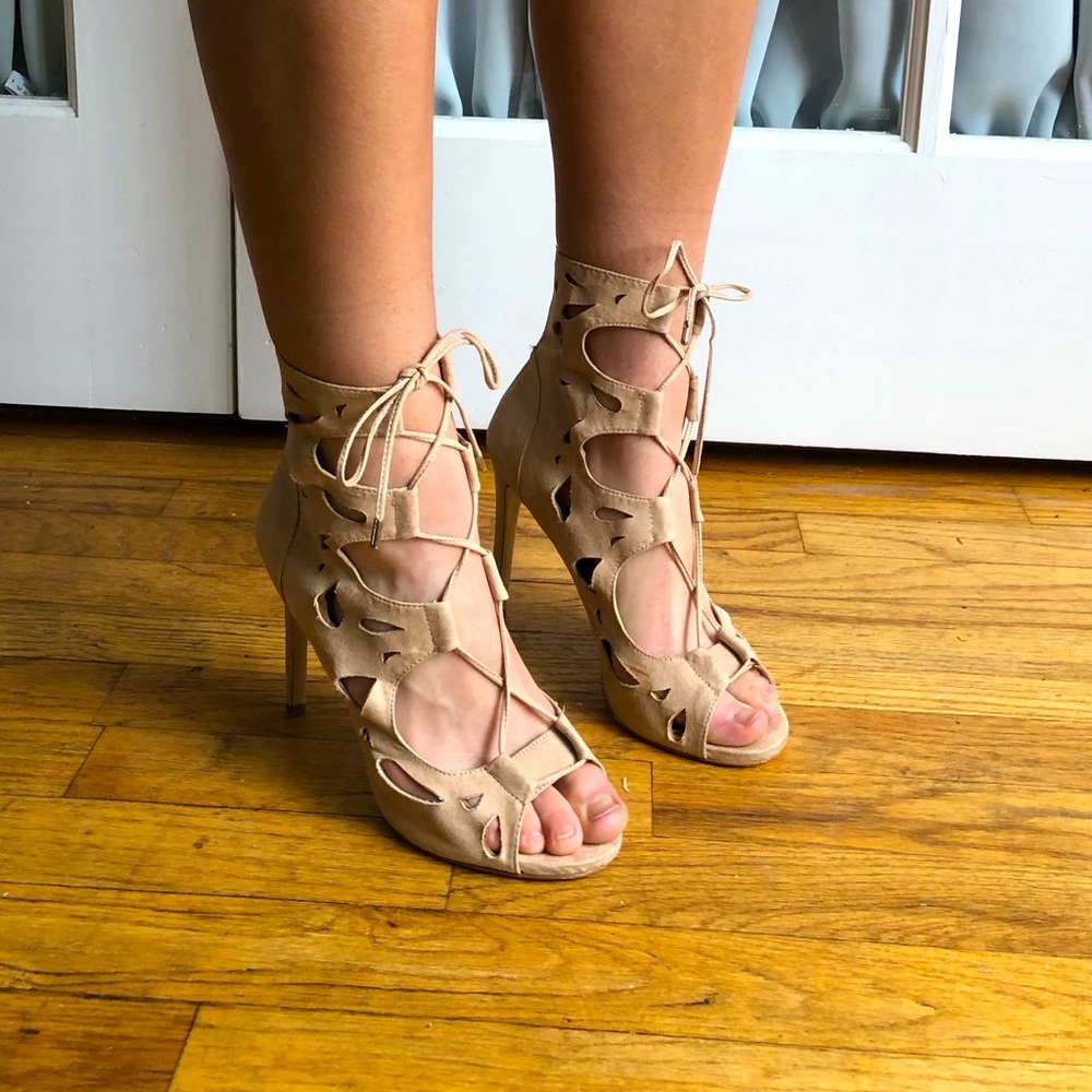 All beige laces up high heels, bow at front